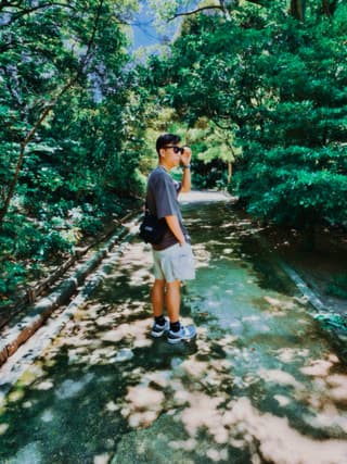 A photo of myself walking in a bamboo forest in Kyoto, Japan.
